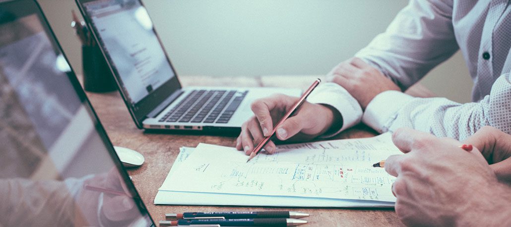 Diverse team of professionals collaborating, representing expertise in a professional services firm.