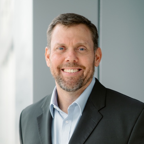 man wearing suit jacket outside